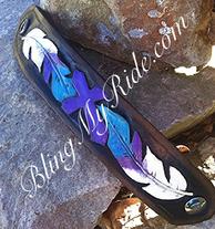 Purple, turquoise and white cuff bracelet. Hand tooled and painted feathers and cross.